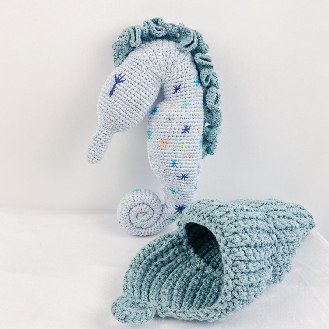 Handmade stuffed animal sea shell basket made of organic cotton by Bebemoss, soft and eco-friendly for children.