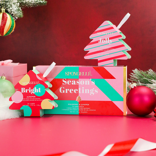 Spongellé Season's Greetings holiday tree gift set with body wash-infused buffer, festive packaging, and holiday-themed design.