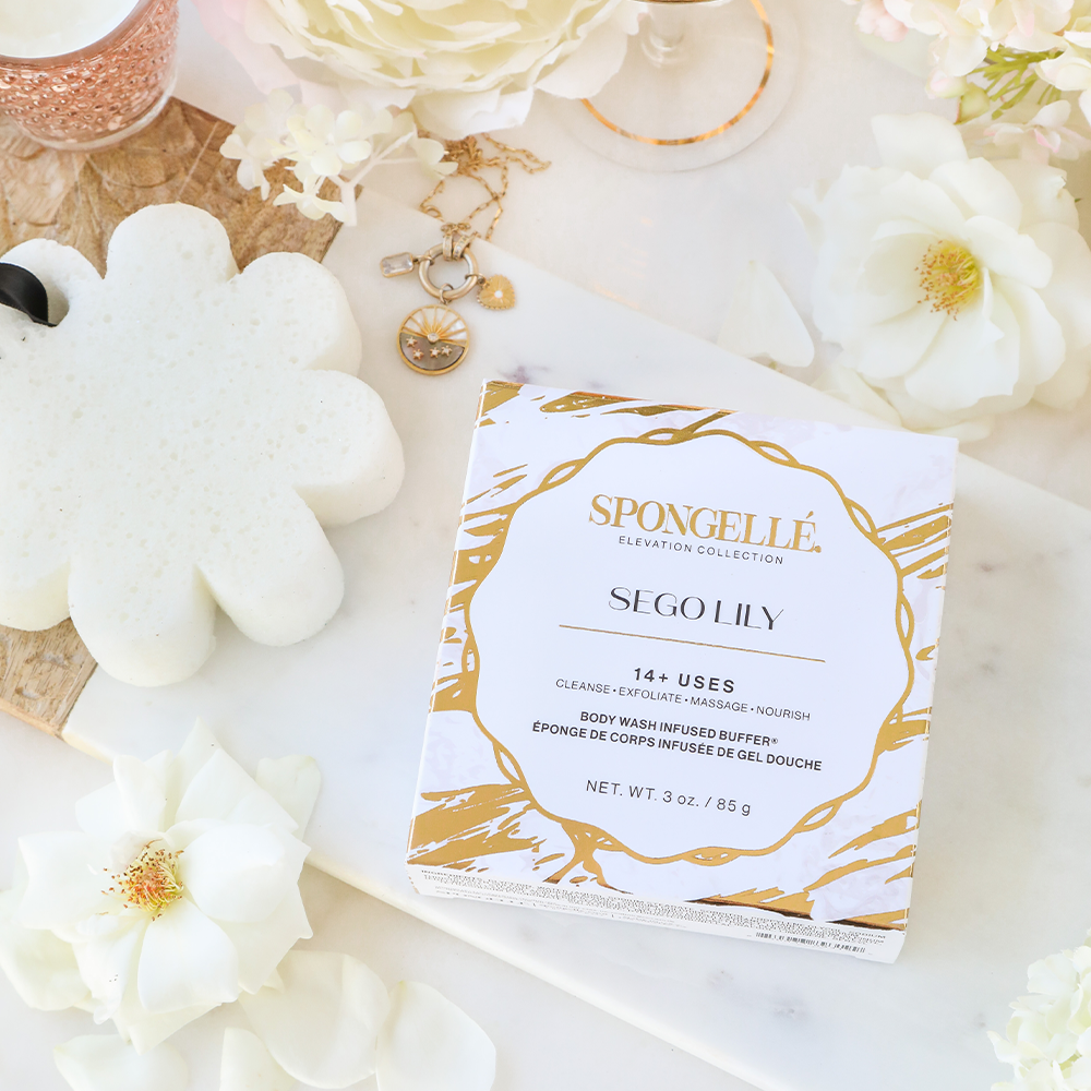 Spongellé Sego Lily Elevation Boxed Body Wash Infused Buffer showing the floral-embossed buffer with packaging.