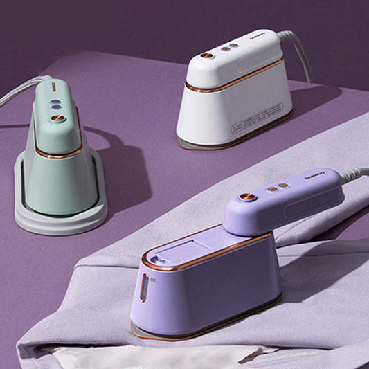 Small handheld steam iron by Sell My Stuff, ideal for ironing clothes at home or while traveling.