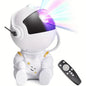 Shaketea astronaut night light projector with black guitar design, projecting starry night images for aesthetic room decor.