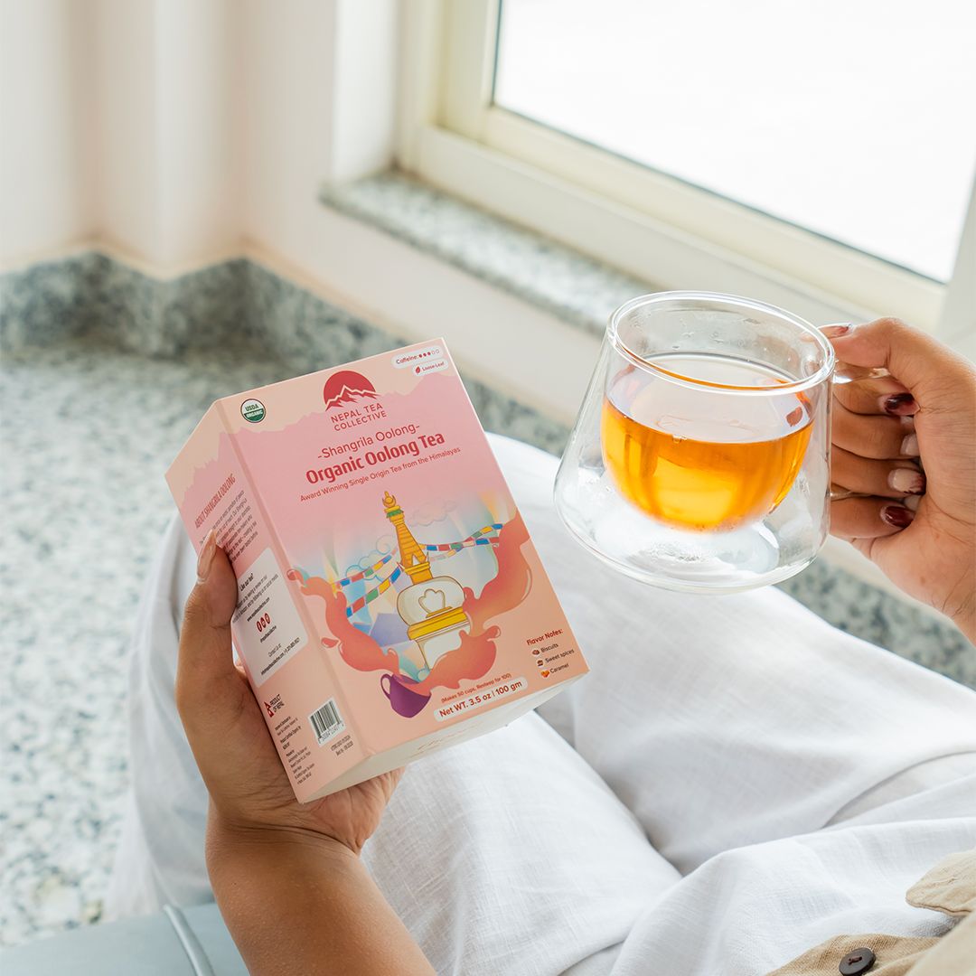 Organic Shangri-La Oolong tea leaves from Nepal Tea, showcasing the rolled and dry tea leaves in a close-up image.