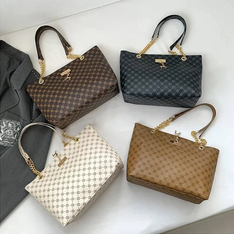 White luxury women's crossbody handbag with soft leather texture, large capacity tote, hanging accessories, and shoulder strap.