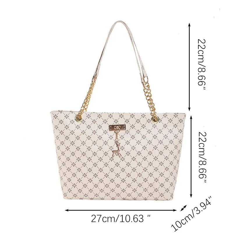 White women's luxury crossbody handbag with soft leather texture, large capacity tote, hanging accessories, and shoulder strap.