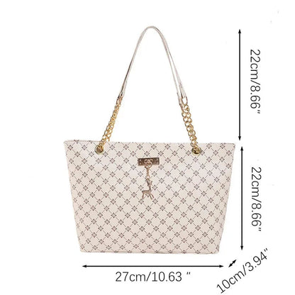 White women's luxury crossbody handbag with soft leather texture, large capacity tote, hanging accessories, and shoulder strap.