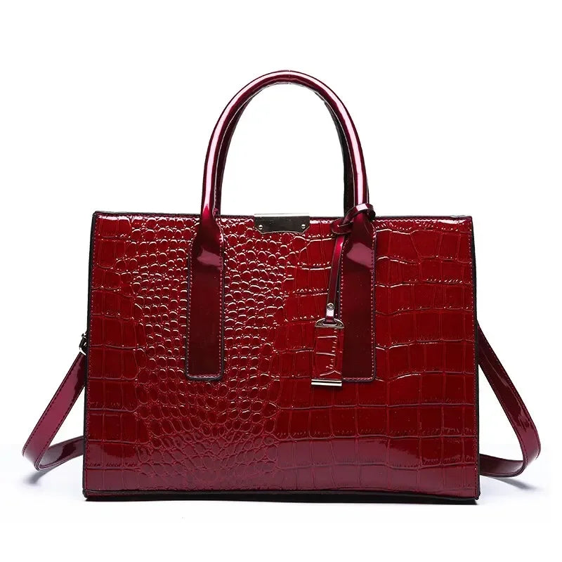 Wine red luxury vintage women's crocodile pattern leather handbag with large capacity tote and shoulder strap.