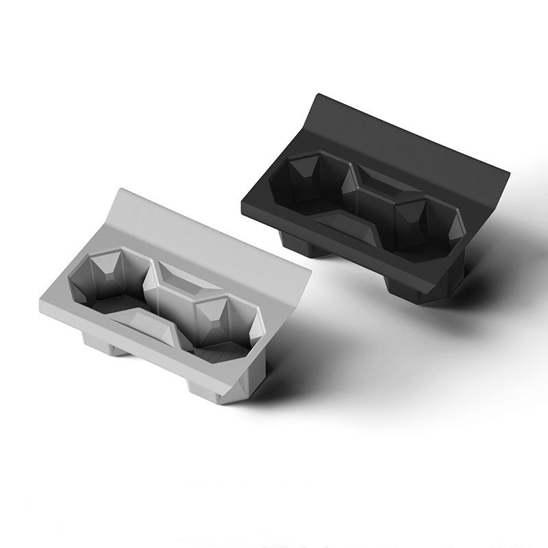 Silicone center console cup holder for Tesla Cybertruck, designed for secure beverage placement inside the vehicle.