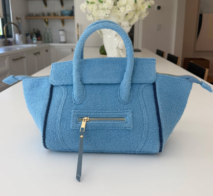 Sky blue BEACH HAUS Cabana Tote Mini bag with woven texture and sturdy handles, perfect for beach or casual outings.