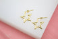 Small open star gold-filled hoop earrings by MIA Jewelry, minimalist and modern design in 18K gold-filled metal.