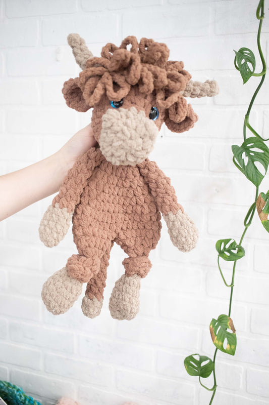 Crochet Highland Cow stuffed animal lovey from The McGarvey Workshop, soft plush Highland Cow snuggler for children.
