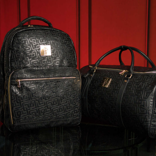 Sole Premise Monogram Leather 2 Bag Set with a sleek commuter bag and spacious duffle bag, crafted from premium leather.