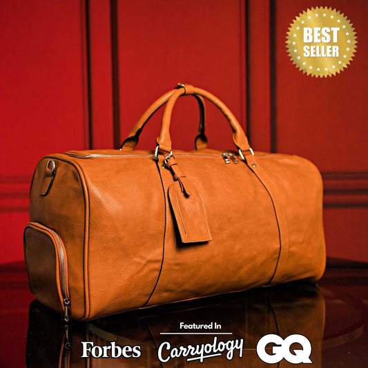 Brown tumbled leather duffle bag by Sole Premise, showing sturdy handles, zipper closure, and spacious interior for travel.