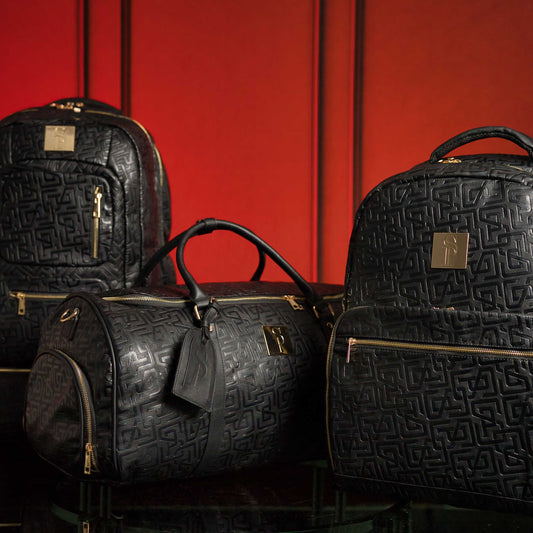Sole Premise Monogram Leather 3 Bag Set including a signature backpack, commuter bag, and duffle bag, all in matching leather luggage.