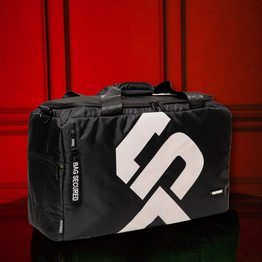 Black Sole Premise sneaker duffle bag with adjustable shoulder strap and side zipper pocket, designed for sports and gym use.