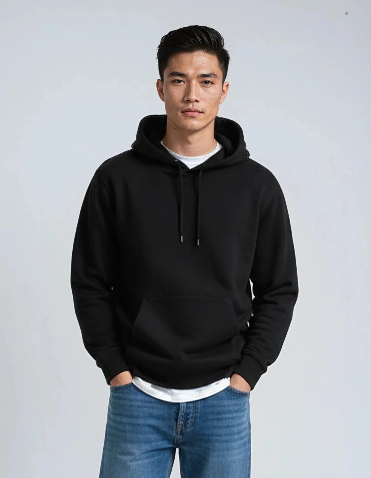 Black fleece heavyweight hoodie from SpectraUSA, shows a cozy, thick fabric hoodie with a front pocket and hood.
