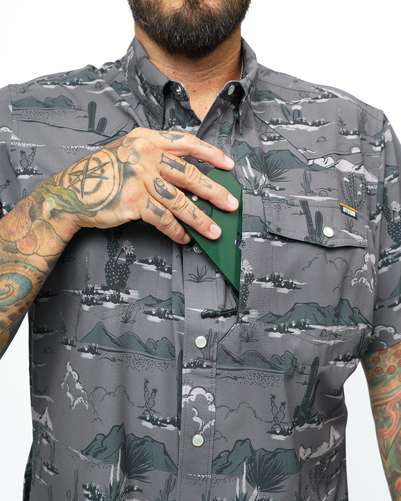 Dark grey short sleeve button-up shirt from Off The Grid Surplus San Saba SS Shirt in Castlerock color, laid flat for display.