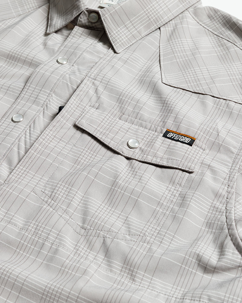 Storm grey Deke SS Shirt by Off The Grid Surplus, short sleeve button-up shirt shown on a hanger.