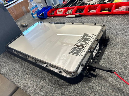 Black Star Mount Systems all-in-one 12V flat mount for Gen 2 Starlink, shown with clear lid and secure mounting features