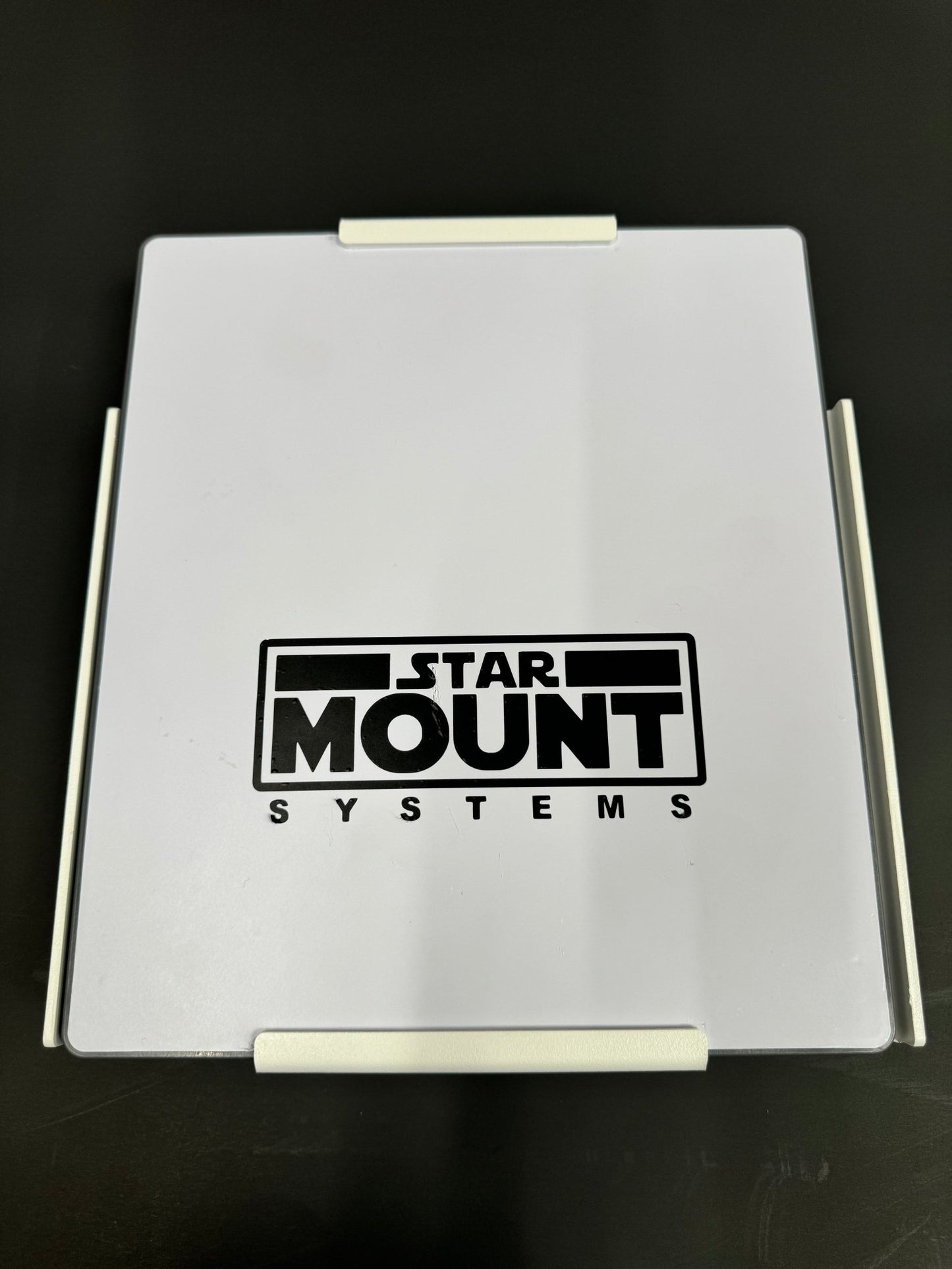 Black Star-Mount MINI Explorer mount for versatile camera and accessory attachment by Star Mount Systems.