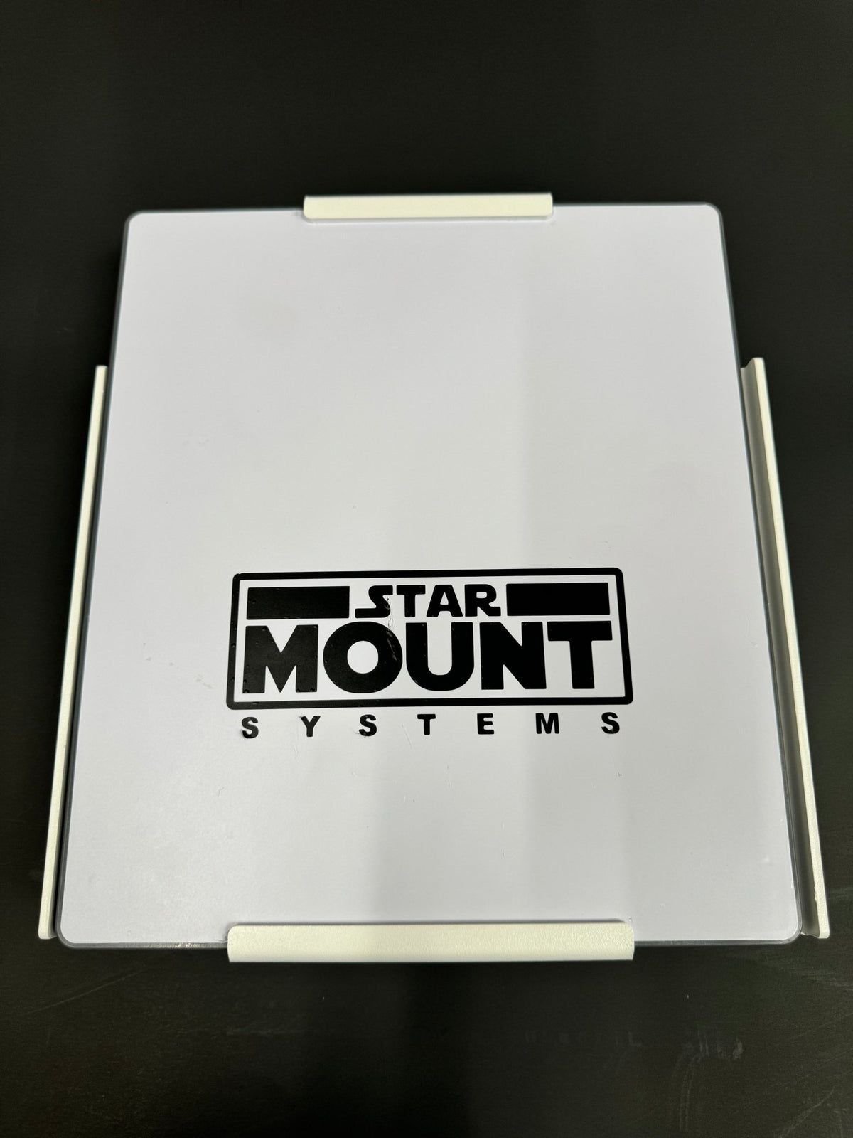 Black Star-Mount MINI Explorer mount for versatile camera and accessory attachment by Star Mount Systems.