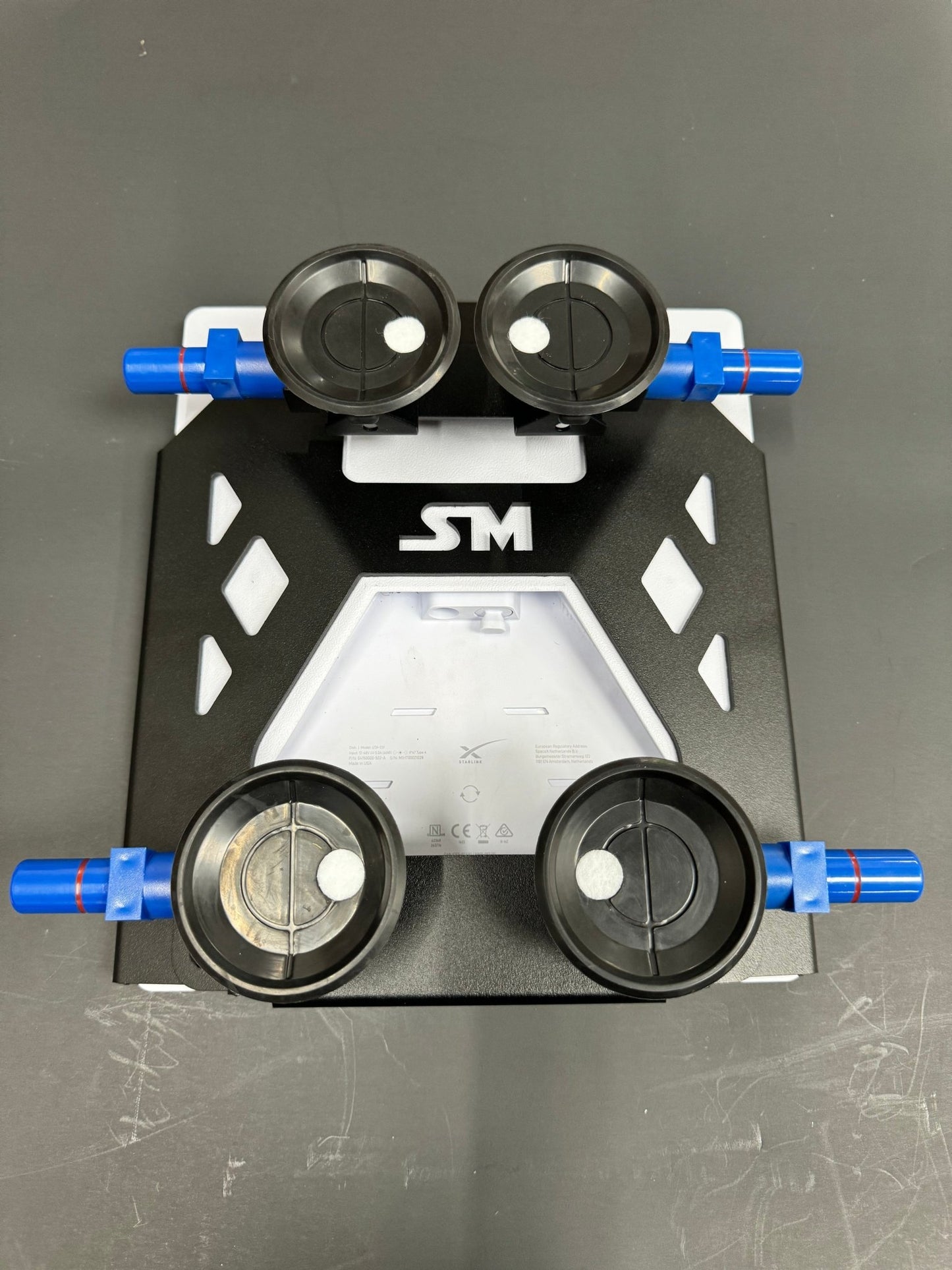 Black Star-Mount MINI Explorer mount by Star Mount Systems, designed for secure attachment of devices or accessories.