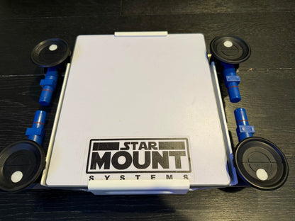 Black Star-Mount MINI Explorer PRO mount by Star Mount Systems for securing cameras or accessories.