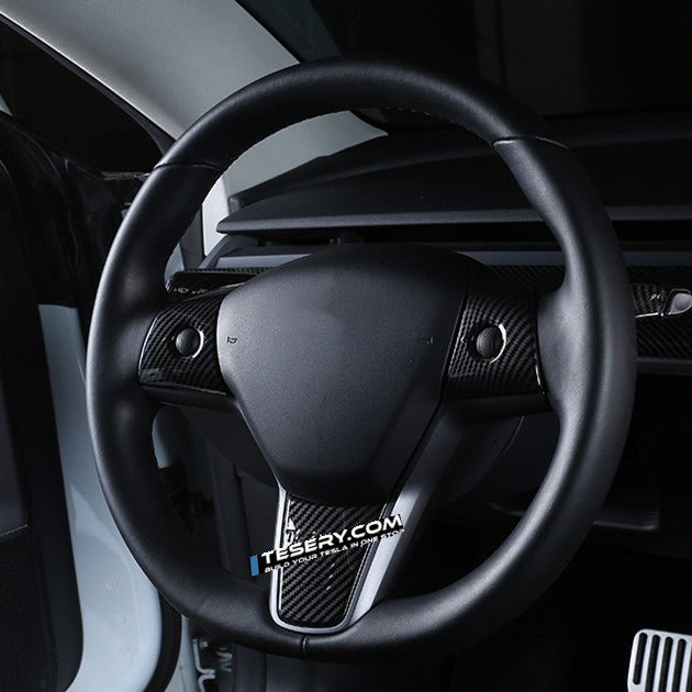 Tesla Model 3 and Y steering wheel cover patch by Tesery, showing a close-up of the textured black steering wheel cover.