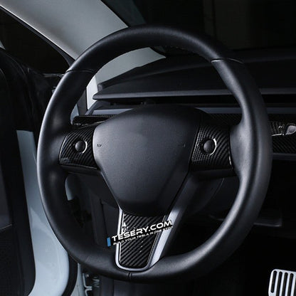Tesla Model 3 and Y steering wheel cover patch by Tesery, showing a close-up of the textured black steering wheel cover.