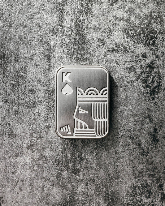 Steinshant Studio Shuffle Pocket Kings V2 fidget slider in satin silver with intricate king design on smooth metal surface.