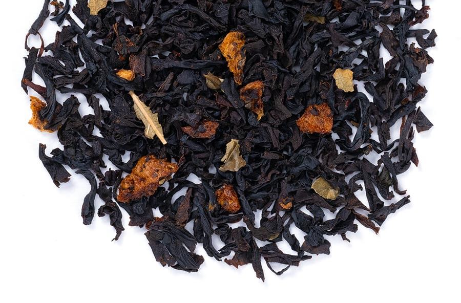 Loose leaf black tea with strawberry flavor from Novel Tea Book Shop, showing dried black tea leaves and strawberry pieces.