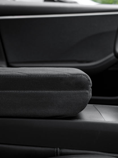 Suede armrest cover with raised pad and tissue box for Tesla Model Y Juniper and Model 3 Highland interior, by Tesery Official.