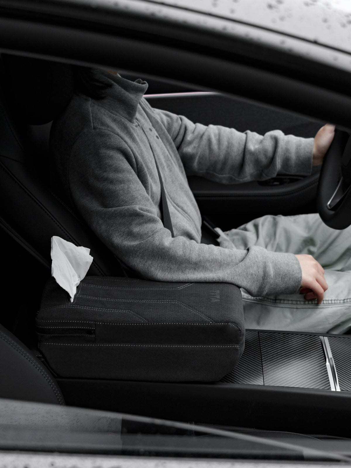 Suede armrest cover with raised pad and tissue box for Tesla Model Y Juniper and Model 3 Highland, by Tesery Official.
