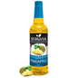 Bottle of Syruvia sugar-free pineapple syrup with a clear label, showing the golden-yellow liquid inside.