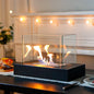 Rectangular tabletop fireplace with four-sided glass panels, gel and ethanol compatible fire bowl by JHY DESIGN.