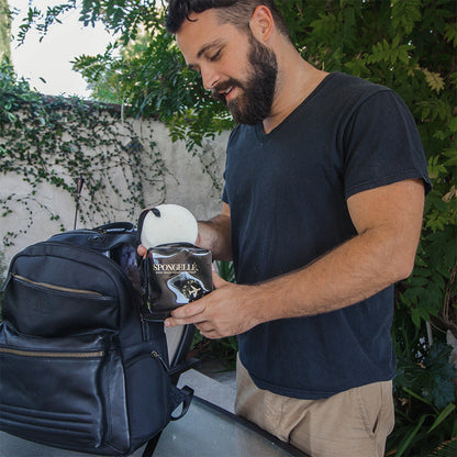 Black Spongellé travel case with a sleek, compact design, perfect for organizing toiletries on the go.