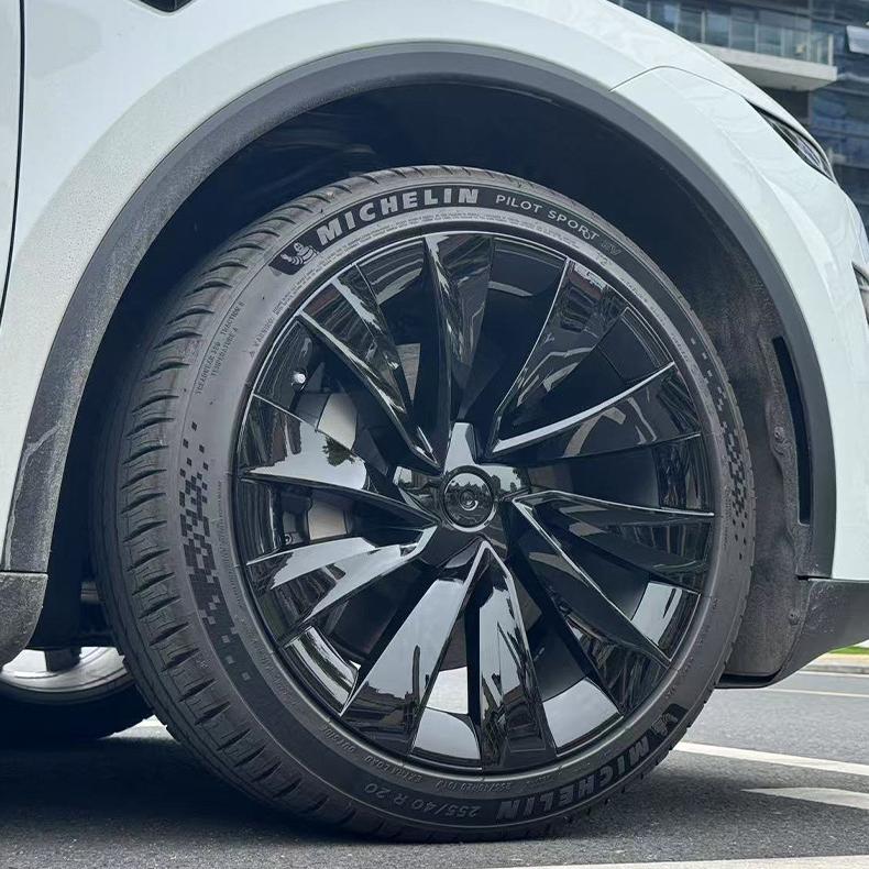 Tesla Model Y Juniper 20-inch Helix Wheel Covers by TESERY, featuring sleek silver design and modern aerodynamic style.