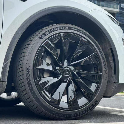 Tesla Model Y Juniper 20-inch Helix Wheel Covers by TESERY, featuring sleek silver design and modern aerodynamic style.