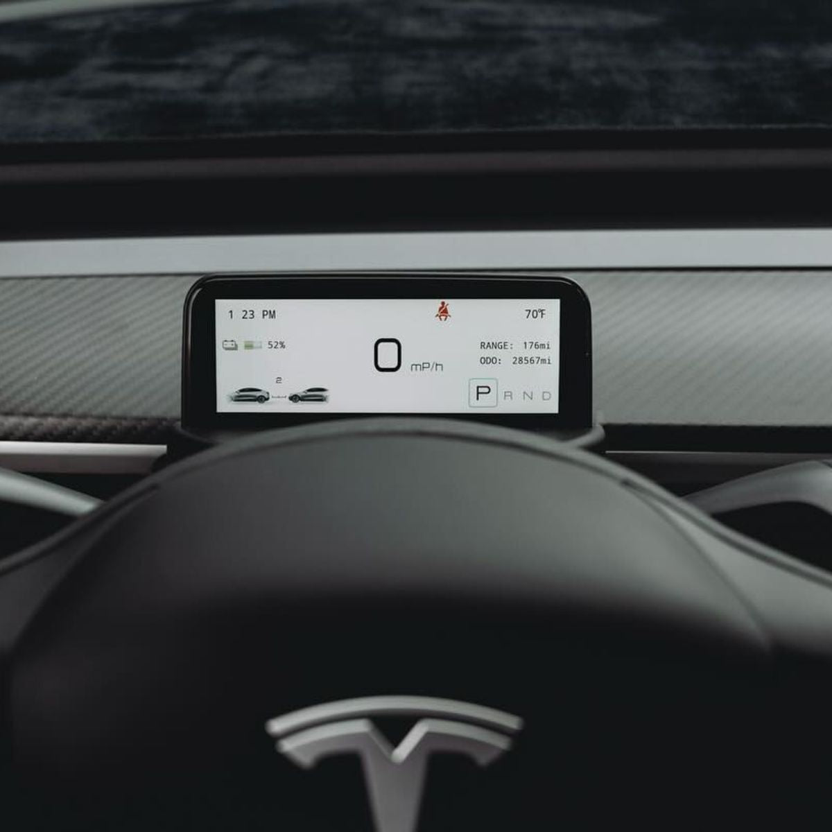 Tesla Model 3 and Y TESERY 4.6-inch mini dashboard display screen showing digital readouts and interface in close-up.
