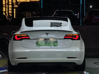 Tesla Model 3/Y Dragon Scale Tail Lights by Tesery, featuring sleek, dragon scale design on the vehicle's rear lights.