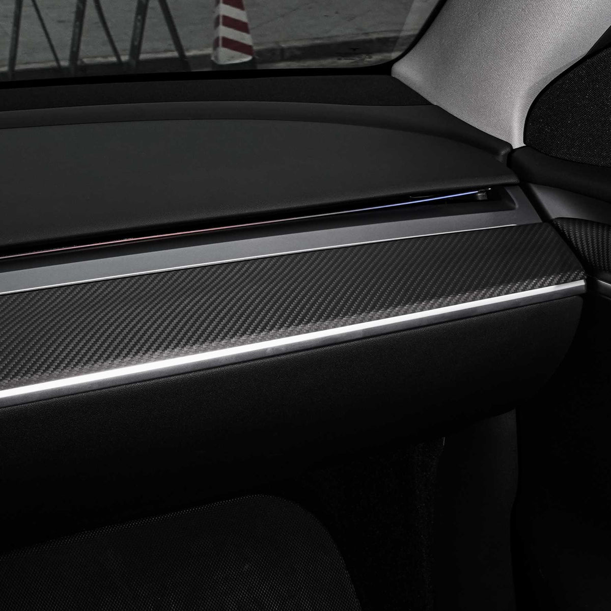 Tesla Model 3/Y dashboard cover in dry carbon fiber from Tesery Official, showing sleek interior mod design.