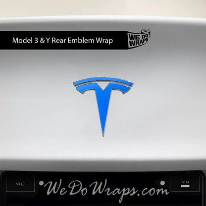 Tesla Model Y with 3M Gloss Fire Blue Tesla emblem decals on front and rear, featuring sleek blue emblems for a custom look.