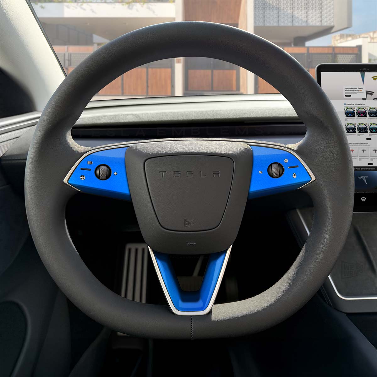 3M Gloss Fire Blue Tesla steering wheel trim decal kit with three decals for Model Y 2026+ refresh, by Tesla Emblems.