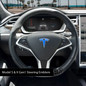 Set of four Tesla Emblems 3M Gloss Fire Blue steering wheel wraps for Model X, designed as decals for a sleek interior look.
