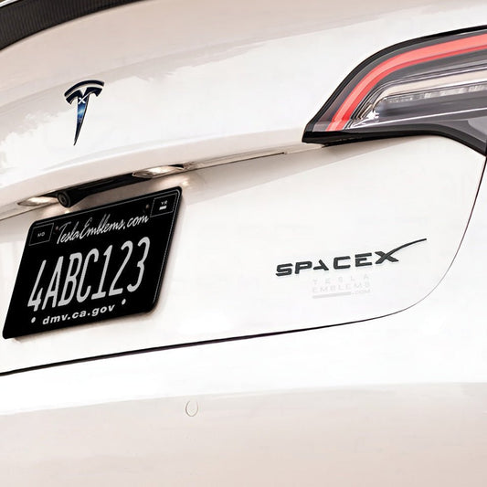 Black ABS SpaceX logo emblem for Tesla rear trunk, vehicle accessory with SpaceX branding and sleek black design.