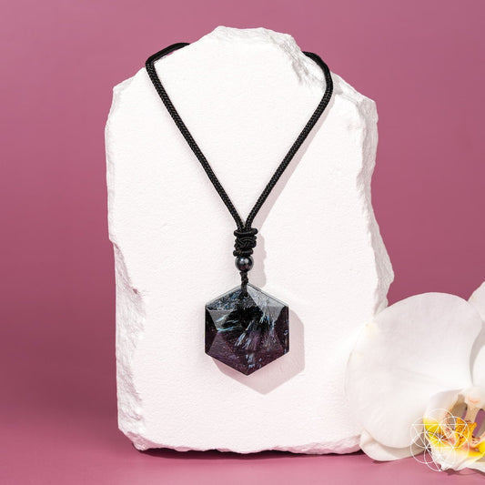 Deep healing Arfvedsonite pendant necklace by Conscious Items featuring a polished black gemstone pendant on a silver chain.