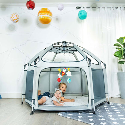 Pop 'N Go® Playpen in cosmic gray by The California Beach Company LLC, showing its portable design and mesh sides for easy visibility.