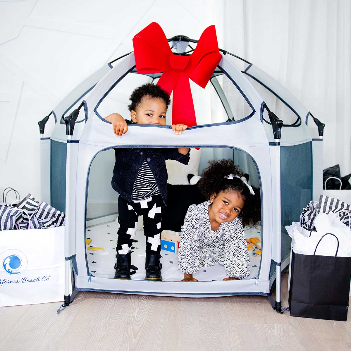 Pop 'N Go® Playpen in cosmic gray by The California Beach Company LLC, showing a portable, foldable playpen with mesh sides.