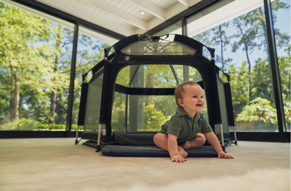 Pop 'N Go Playpen in cosmic gray by The California Beach Company LLC, showing the portable, foldable playpen with mesh sides.