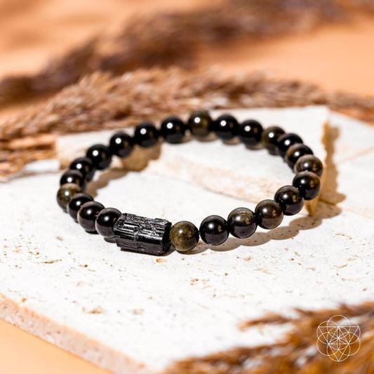 Conscious Items Energy Protection Bracelet featuring black cord and silver-toned beads for spiritual energy and protection.