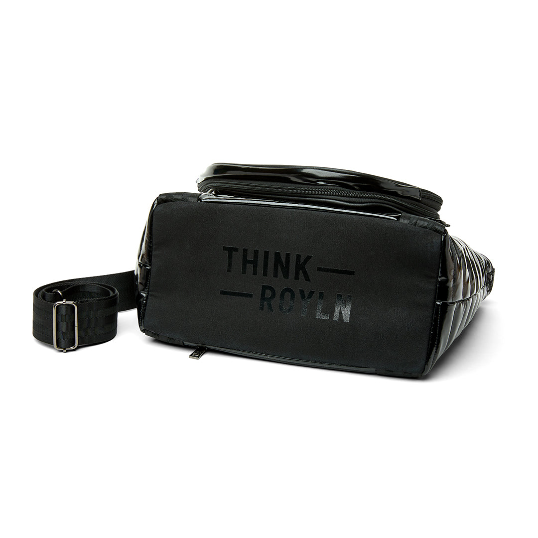 Think Royln Ace of the Court pickleball bag in sleek black patent finish, designed for convenient storage and carrying.